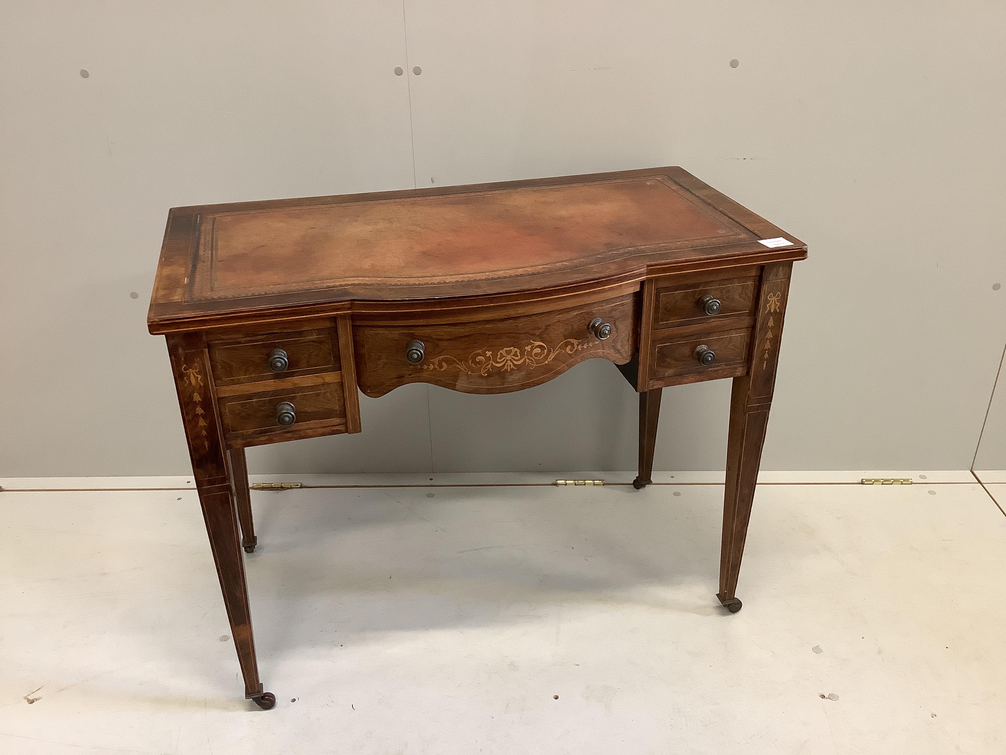 A late Victorian marquetry inlaid rosewood bowfront writing table, width 91cm, depth 49cm, height 72cm